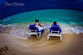 Cuba destination wedding, bride & groom, lounge chairs in ocean