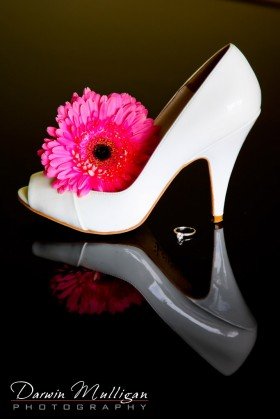 Bride's shoe and reflection from piano
