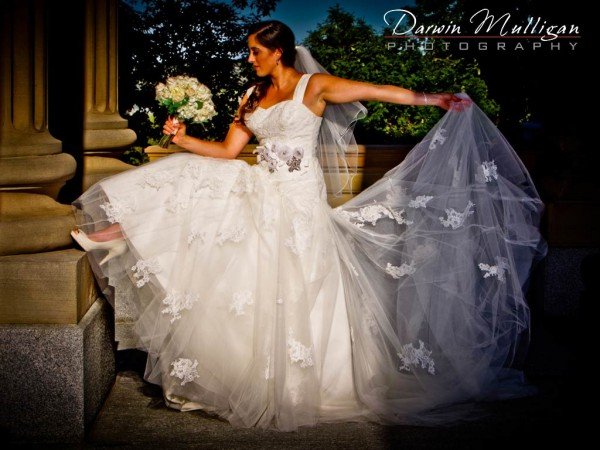 Liza shows off her wedding dress and shoe at Edmonton Legislature Building