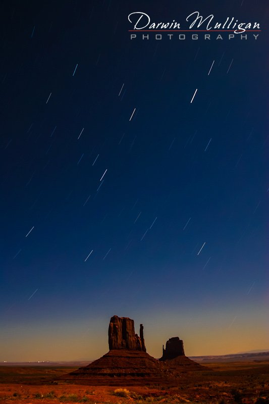 The Mittens at Monument Valley captured at full moon showing Star Trails