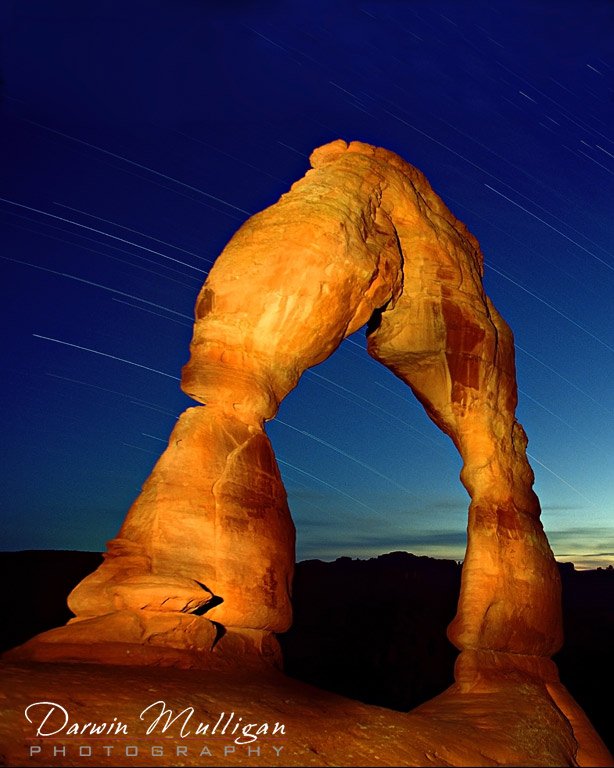 Startrails and light-painting illuminate Delicate Arch, Arches National Park, Utah