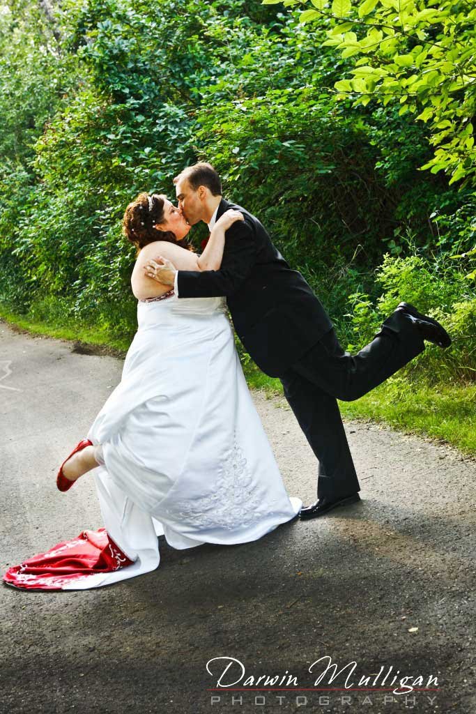 LeeAnn and Blake kiss on their Red Deer Wedding day